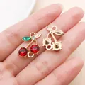 Close-up of sparkling rhinestone cherry charm for DIY earring and bracelet jewelry making - Double Hanging Rhinestone Style (23394) / 1 Piece (19x15x5mm) / KC Gold Red Double Hanging Rhinestone Cherry