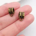 Detailed view of antique bronze patterned alloy spacer beads for DIY jewelry making crafts - Classic Relief Bail (20673)