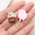 Detailed view of resin cupcake charm with 'Sweet' lettering and rainbow frosting design - Milkshake Cake (24528)