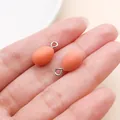 Small orange egg-shaped DIY resin pendant charm for handmade jewelry and keychains - Orange Resin Miniature Egg (27567) / 1 Piece (15x8x8mm) / Orange