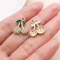 Gold-plated cherry charm with sparkling rhinestones and green enamel leaves for jewelry - KC Gold White Enamel Rhinestone Cherry