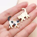 Detail showing front and back of a cute calico cat enamel charm for DIY jewelry - Enamel Printed Walking Cow Cat (27757) / 1 Piece/Pack (22x20mm) / Black and White
