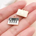 Emaille bedeltje met pianoklavier en gouden afwerking voor doe-het-zelf sieraden - Emaille Piano (19461) / 1 stuk (13x15mm) / Zwart