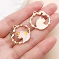 Macro detail shot showing front and back of colorful enamel unicorn charms for DIY jewelry. - Round Unicorn Ring (11452)