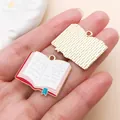 Detailed view of red enamel book charm for graduation theme DIY jewelry making - Red Book (27463)