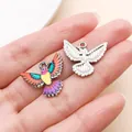Detailed view of colorful printed and silver hummingbird charms for DIY jewelry - Wings Spread Hummingbird Charm (27650)