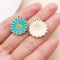 Detail view of lake blue enamel daisy pendants showing front and textured metal back - Sunflower (12053) / 1 Piece (18x21mm) / Lake Blue