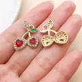 Shiny gold-toned cherry pendant with red heart rhinestones for DIY jewelry making - KC Gold Red Heart Rhinestone Cherry
