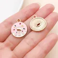 Close-up of pink enamel donut charms with gold-tone back for DIY jewelry crafting - Pink Donut (15659) / 1 Piece/Pack (17x21mm)