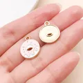 Detailed macro view of pink enamel donut charms for DIY jewelry and keychain pendants. - Pink Donut (24688)