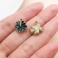Hand holding a black enamel flower charm with rhinestones for DIY jewelry making accessories - Rhinestone Flower (16698)