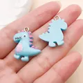Cute ice blue resin dinosaur charms for DIY jewelry making like bracelets and earrings. - Animal Dinosaur (24514)