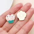 Colorful enamel cupcake charm accessory, front and back view held in hand for scale - White Brown Cake (24686)