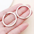Close-up of 30mm polished silver metal flat key rings for DIY jewelry making and crafts - 30x30mm / White Gold