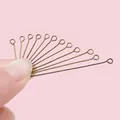 Detailweergave van antieke bronzen oogspelden voor DIY-sieraden en knutselprojecten - 16x3mm / Dikte 0.7mm / Antiek Brons