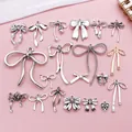 Detailed view of 20 antique silver bow charms for DIY jewelry making and accessories - 20 Style Bowknot Collection 1 Piece Each (SN1634) / 20 Pieces Set / Antique Silver