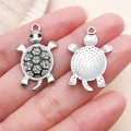 Detailed front and back view of silver turtle charm with sparkling rhinestones - Black Enamel Rhinestone Ocean Turtle (27056) / 1 Piece/Pack (29x17mm) / Silver
