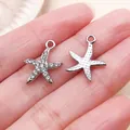 Close-up of silver starfish pendants with clear rhinestone pave and dotted texture - Rhinestone Marine Starfish Star (27102) / 1 Piece (16x14mm) / Silver
