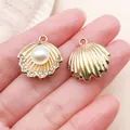 Close-up of gold shell charms with pearl and rhinestones for DIY jewelry making - Rhinestone Shell with Artificial Pearl Style (27115) / 1 Piece (20x20mm) / KC Gold
