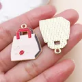 Detail showing both sides of a coffee bag shaped alloy pendant with enamel finish. - Coffee Packaging Bag (27172) / 1 Piece (26x21mm) / Pink