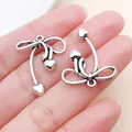 Dije de lazo de plata vintage con diseño hueco y pequeños corazones para DIY - Colgantes de corazón con lazo de plata antigua