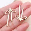 Elegante colgante de lazo hueco de metal dorado para la creación de joyas y collares DIY - Lazo Hueco (22864) / 1 unidad (32x19mm) / Oro KC