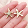 Gold-toned starfish charms with sparkling rhinestones for DIY necklace making. - Rhinestone Marine Starfish Star (27105) / 1 Piece (20.5x19mm) / Gold