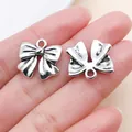 Dijes de lazo en plata vintage para joyería DIY, vista frontal y posterior - 24722 - 1 Pieza 16x17x3 Mm - 19 G Arco De Aleación De Zinc Plateado Antiguo
