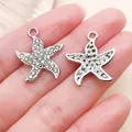 Sparkling silver starfish pendant set with small rhinestones for DIY jewelry design. - Rhinestone Marine Starfish Star (27106) / 1 Piece/Pack (22x19mm) / Silver