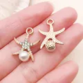 Exquisite gold-plated zinc alloy starfish pendant featuring rhinestones and a white pearl - Rhinestone Starfish with Artificial Pearl Style (27109) / 1 Piece/Pack (21x16mm) / KC Gold