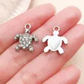 Silver rhinestone-paved sea turtle pendant with a textured back for DIY jewelry making - Rhinestone Ocean Turtle Pendant (27120) / 1 Piece/Pack (17x14mm) / Silver