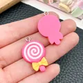 Close-up detail of a handmade pink resin lollipop charm with a yellow bow and white swirl. - Bow Lollipop Style (24472) / 1 Piece (28x18x4mm) / Rose Red
