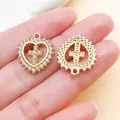 Detailed macro view of heart cross alloy pendant with sparkling rhinestone details - KC Gold Rhinestone Heart Cross (27085)