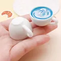 Detailed view of miniature resin coffee cups featuring blue swan latte art patterns for DIY craft - Multi-Layer Latte Art (24790) / Blue
