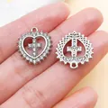 Close-up of heart cross pendant showing rhinestone details and metal back design. - White K Rhinestone Heart Cross (27084)