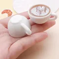 Close-up of miniature resin coffee cups with detailed heart-shaped latte art design - Multi-Layer Heart Latte Art (24789) / Coffee Brown