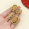 Detailed view of gold enamel hulu pendants with traditional patterns and Lu character. - 1 Piece/Pack (42x27mm)