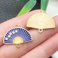 Close-up of blue enamel fan charm and gold alloy back with plum blossom details for DIY. - Plum Blossom Fan (22451) / 1 Piece/Pack (24x19mm) / Violet Blue