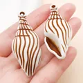 Colgantes de acrílico con forma de caracola para accesorios de joyería DIY marrón - Concha Marina (27399) / 1 Pieza (50x21mm) / Marrón