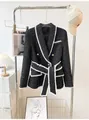 Detailed shot of an elegant black tweed blazer featuring white fringe trim and gold buttons - XL / Tops / Black