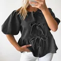 Dettaglio di una camicia di jeans nera con maniche a sbuffo e tre fiocchi sul davanti - 3XL / Top / Grigio