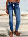 Detailed view of women's skinny jeans with contrast white stitching and button fly. - S / Bottoms / Blue
