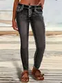 Close-up of slim fit stretch skinny jeans with white contrast stitching and button fly - S / Bottoms / Black