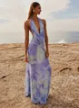 Elegant purple floral halter maxi dress shown on a model at a scenic rocky beach - S / Top And Bottom / Purple