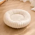 Cozy cream-colored round plush pet bed with soft ribbed texture for cats and dogs. - Off White