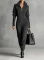 Dettaglio moda di una tuta in maglia a costine grigio scuro con collo alto e zip - Taglia S / Tute intere / Nero