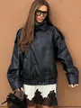 Detailed shot of a stylish black loose-fit women's PU leather motorcycle jacket - S / Tops / Black