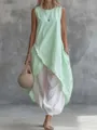 Dettaglio di una tunica senza maniche verde menta abbinata a pantaloni bianchi larghi - XS / Top E Pantaloni / Verde chiaro