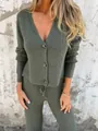 Close-up detail of the dark green ribbed knit cardigan and matching trousers set. - S / Top And Bottom / Army Green