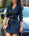 Close-up of black PU leather dress featuring puff sleeves and a chic metallic buckle belt - S / Dresses / Black